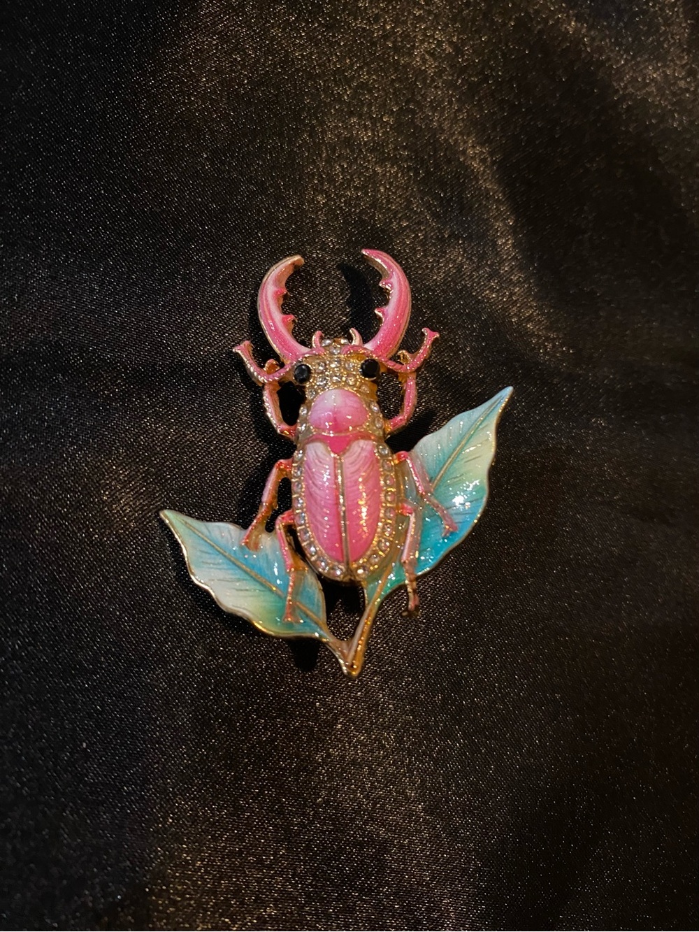 Pink Enamel Stag Beetle Brooch with Blue-Green Leaves